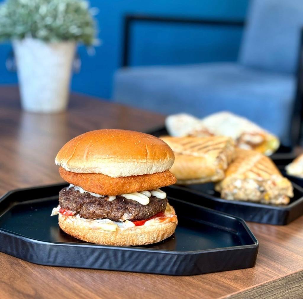 Mayel signature burger on black tray